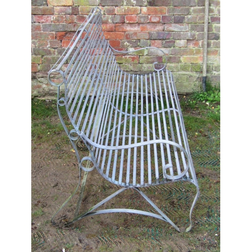 2037 - A sprung galvanised steel garden bench with scrolled back, arms and strap work seat, 6ft long