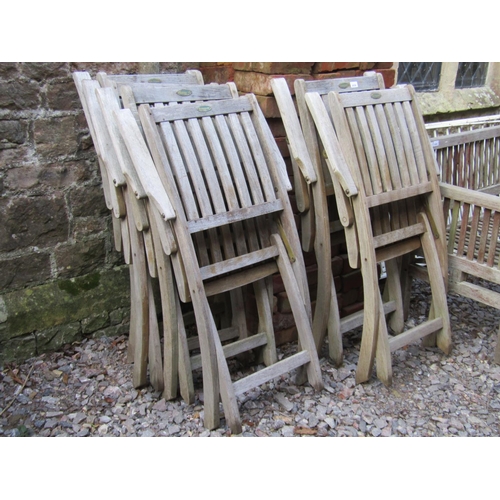 2039 - A set of six weathered Westminster teak folding garden armchairs with slatted seats and backs