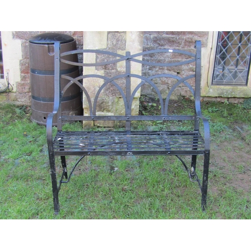 2041 - A Regency style strap work two seat garden bench with lattice and scrolled detail, 100 cm wide, toge... 