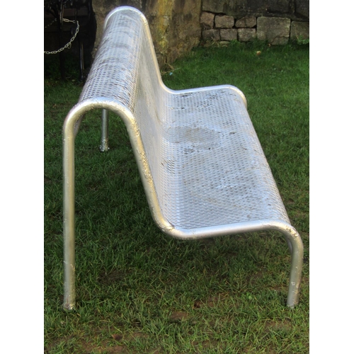 2044 - A municipal park bench with tubular steel frame and repeating pierced pattern seat with over painted... 