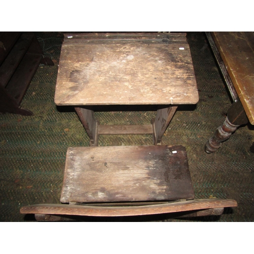 2058 - A vintage child's oak school desk and combined seat together with an early 20th century oak students... 