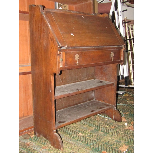 2058 - A vintage child's oak school desk and combined seat together with an early 20th century oak students... 