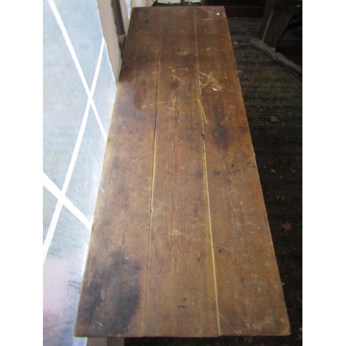 2059 - A Victorian style stained pine kitchen table with rectangular planked top raised on turned supports,... 