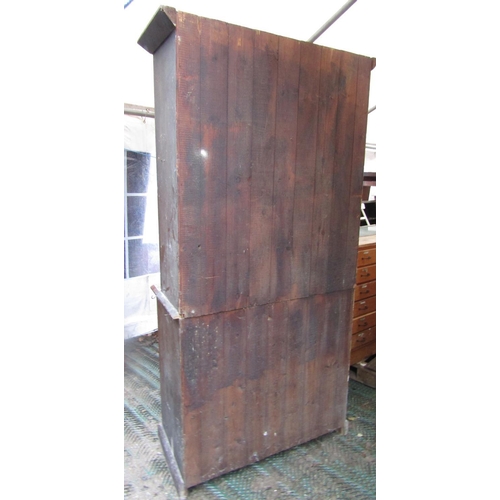 2067 - A vintage stained pine kitchen dresser, freestanding and enclosed by an arrangement of four doors an... 