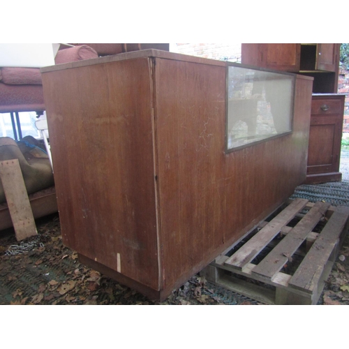 2073 - A vintage oak haberdashery cabinet/counter incorporating a brass framed and glazed centralised cabin... 