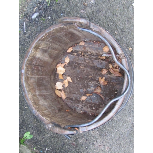 2091 - An old wooden and steel banded well bucket with loose loop handle