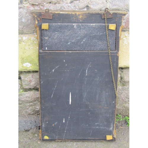 2129 - A small Regency style pier glass with rectangular bevelled edge plate housed within a gilt frame wit... 