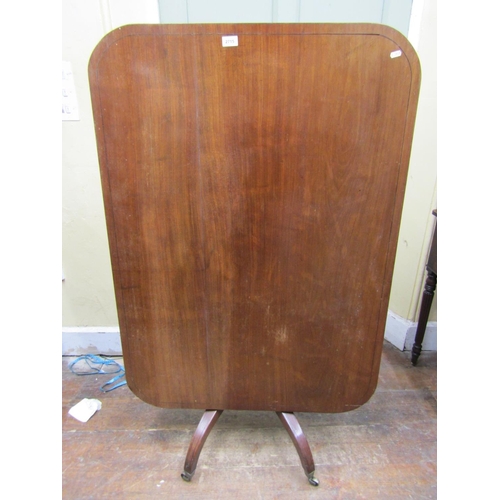 2274 - A Regency mahogany breakfast table, the rectangular top to seat four, raised on a turned pillar and ... 