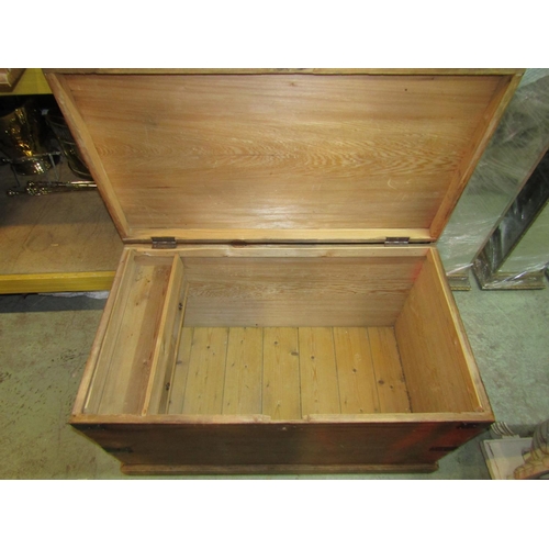 2204 - A large 19th century stripped pine box with hinged lid and iron fittings 100 cm long x 58 cm wide x ... 