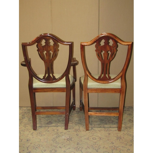 2219 - A set of six (4&2) reproduction Hepplewhite style shield back dining chairs with pierced urn splats ... 