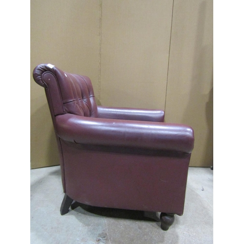 2403 - A contemporary drawing room chair with buttonback and loose cushion, upholstered in a mid brown leat... 