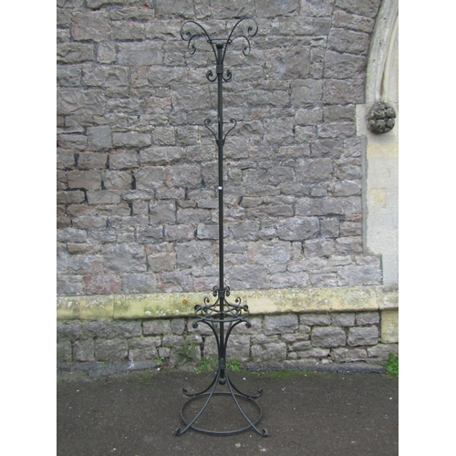 2303 - A contemporary ironwork floorstanding hat/coat stand together with a further iron work stand with fo... 