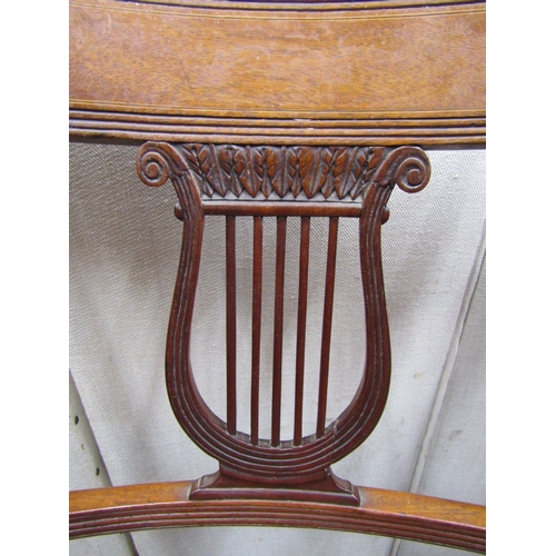 2363 - A set of six Regency period mahogany dining chairs with carved and pierced lyre shaped splats within... 