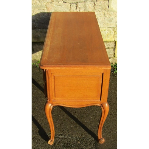 2149 - A vintage French light oak kneehole dressing table fitted with an arrangement of five frieze drawers... 