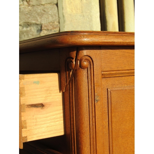 2149 - A vintage French light oak kneehole dressing table fitted with an arrangement of five frieze drawers... 