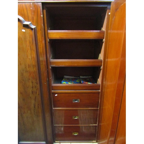 2157 - A Victorian mahogany triple wardrobe with simple moulded cornice over three full length panelled doo... 