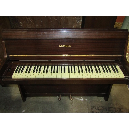 2162 - A Kemble upright iron framed and over strung piano together with an associated piano stool with upho... 