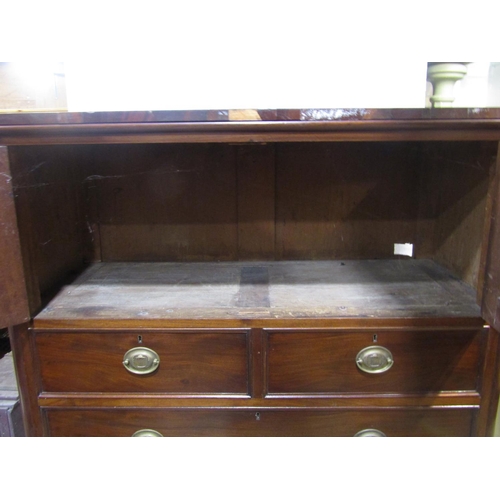 2175 - A 19th century mahogany bedroom chest of four long and two short drawers beneath a cupboard enclosed... 