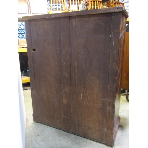 2175 - A 19th century mahogany bedroom chest of four long and two short drawers beneath a cupboard enclosed... 