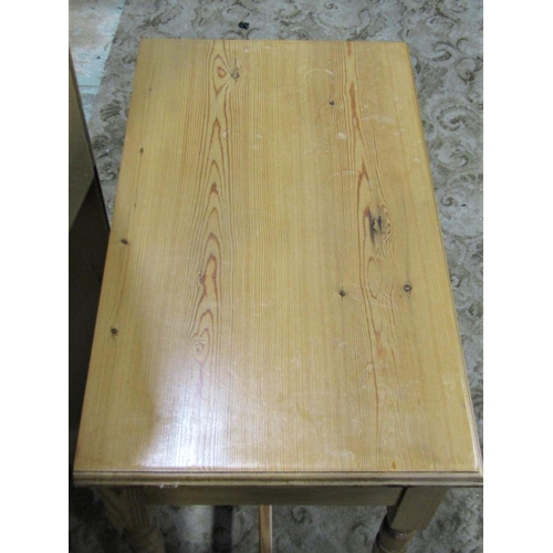 2238 - A stripped pine side table fitted with a frieze drawer raised on turned supports united by H shaped ... 