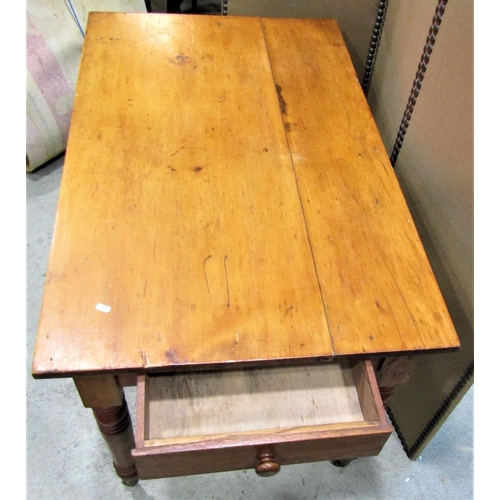 2260 - A stained pine kitchen table of rectangular form with end frieze drawer raised on ring turned and ta... 