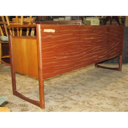 2289 - A mid 20th century G plan low and long teak dressing table fitted with four drawers beneath a raised... 