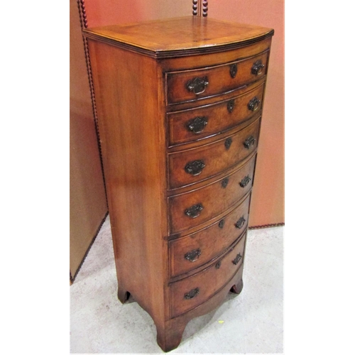 2294 - A Georgian style walnut veneered bow fronted chest of six long oak lined bow fronted drawers over a ... 