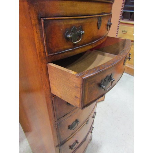 2294 - A Georgian style walnut veneered bow fronted chest of six long oak lined bow fronted drawers over a ... 