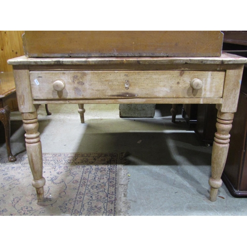 2308 - A Victorian stripped pine farmhouse kitchen table of rectangular form fitted with an end frieze draw... 