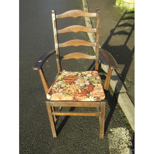 2321 - A pair of dark stained Ercol elm and beechwood ladderback carver chairs with slatted seats together ... 