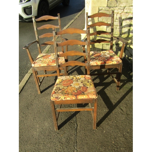 2321 - A pair of dark stained Ercol elm and beechwood ladderback carver chairs with slatted seats together ... 