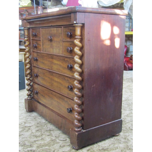 2362 - A substantial Victorian mahogany bedroom chest fitted with an arrangement of nine drawers flanked by... 