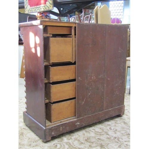 2362 - A substantial Victorian mahogany bedroom chest fitted with an arrangement of nine drawers flanked by... 