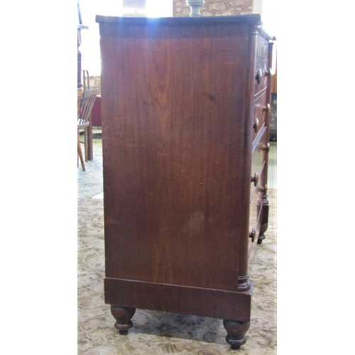 2364 - A substantial 19th century mahogany bedroom chest of four long graduated drawers flanked by split co... 