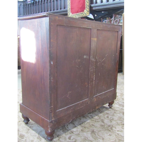 2364 - A substantial 19th century mahogany bedroom chest of four long graduated drawers flanked by split co... 