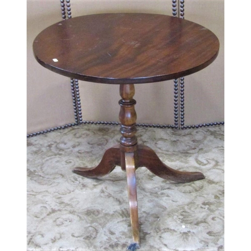 2400 - A Georgian style snap top occasional table of circular form raised on a turned vase shaped pillar an... 