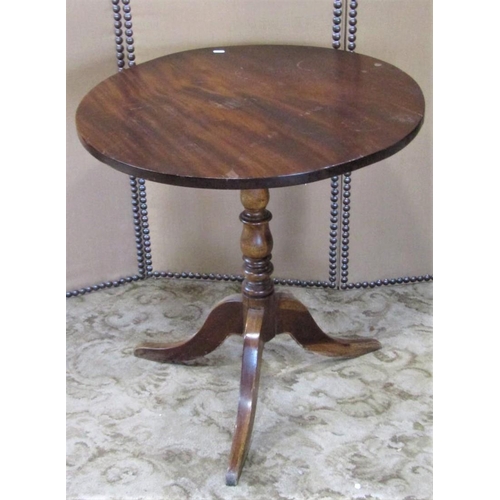 2400 - A Georgian style snap top occasional table of circular form raised on a turned vase shaped pillar an... 