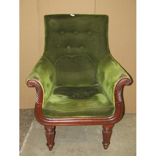 2317 - A Regency armchair with upholstered finish, swept and scrolled arms with showwood detail, raised on ... 