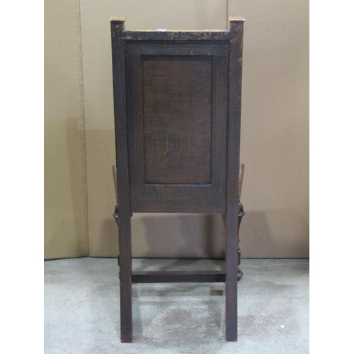 2353 - An old English style oak panel back single chair with linen fold and applied split moulded detail, s... 