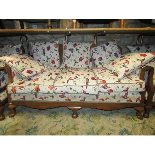 2409 - An Edwardian mahogany three piece suite comprising three seat sofa and a pair of matching armchairs ... 