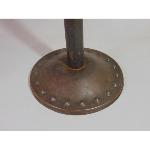 537 - Possibly Goberg, an Arts & Crafts steel candle stand with simple cylindrical stem and domed disc sha... 