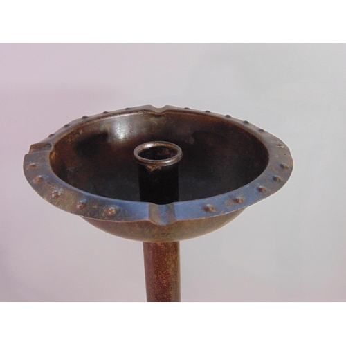 537 - Possibly Goberg, an Arts & Crafts steel candle stand with simple cylindrical stem and domed disc sha... 