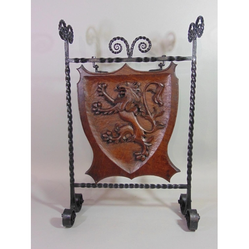 540 - A good quality Arts & Crafts style firescreen, the iron work frame with twisted and scrolled detail ... 