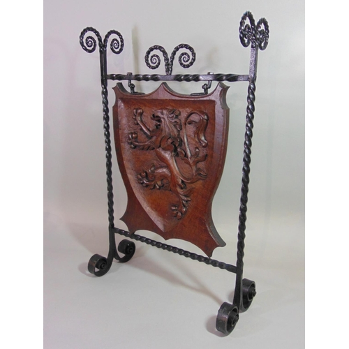 540 - A good quality Arts & Crafts style firescreen, the iron work frame with twisted and scrolled detail ... 