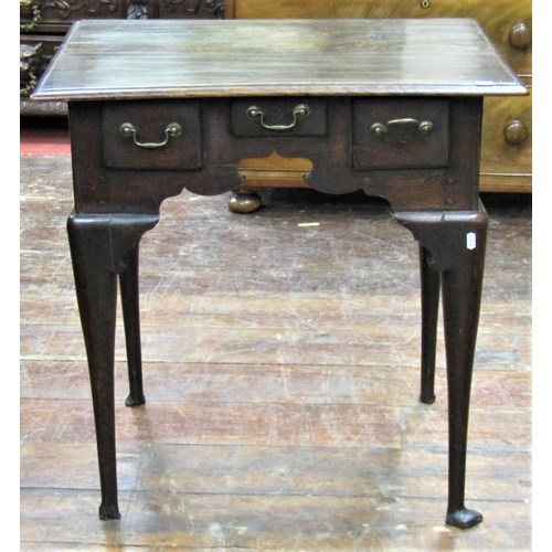 2644 - Georgian oak country made lowboy fitted with three frieze drawers within a shaped frieze raised on f... 