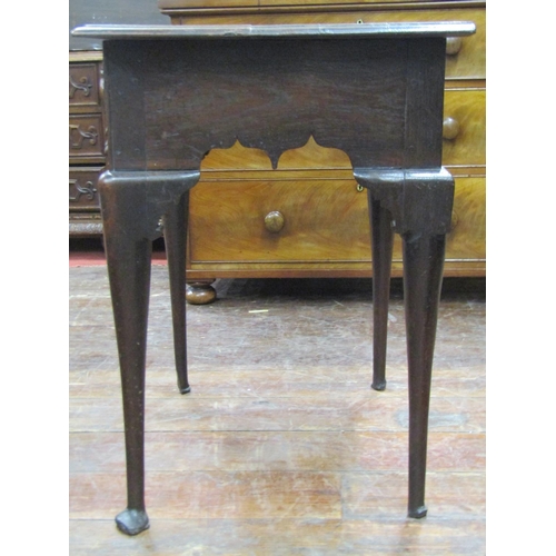 2644 - Georgian oak country made lowboy fitted with three frieze drawers within a shaped frieze raised on f... 