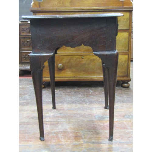 2644 - Georgian oak country made lowboy fitted with three frieze drawers within a shaped frieze raised on f... 