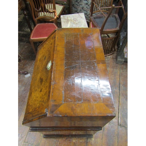 2667 - A small 18th century walnut and figured walnut writing bureau enclosed by three long and two short g... 