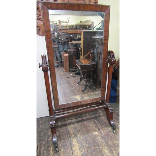 2671 - A substantial mid Victorian period mahogany framed cheval glass, the framework incorporating six col... 