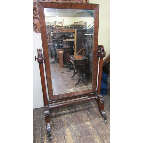 2671 - A substantial mid Victorian period mahogany framed cheval glass, the framework incorporating six col... 